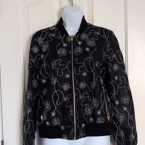 Kate and Mallory. Black jacket, White flower stitch design, size Medium